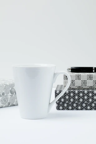 Corporate gift cookie boxes styled with minimalist packaging and subtle sage accents on a clean white background.