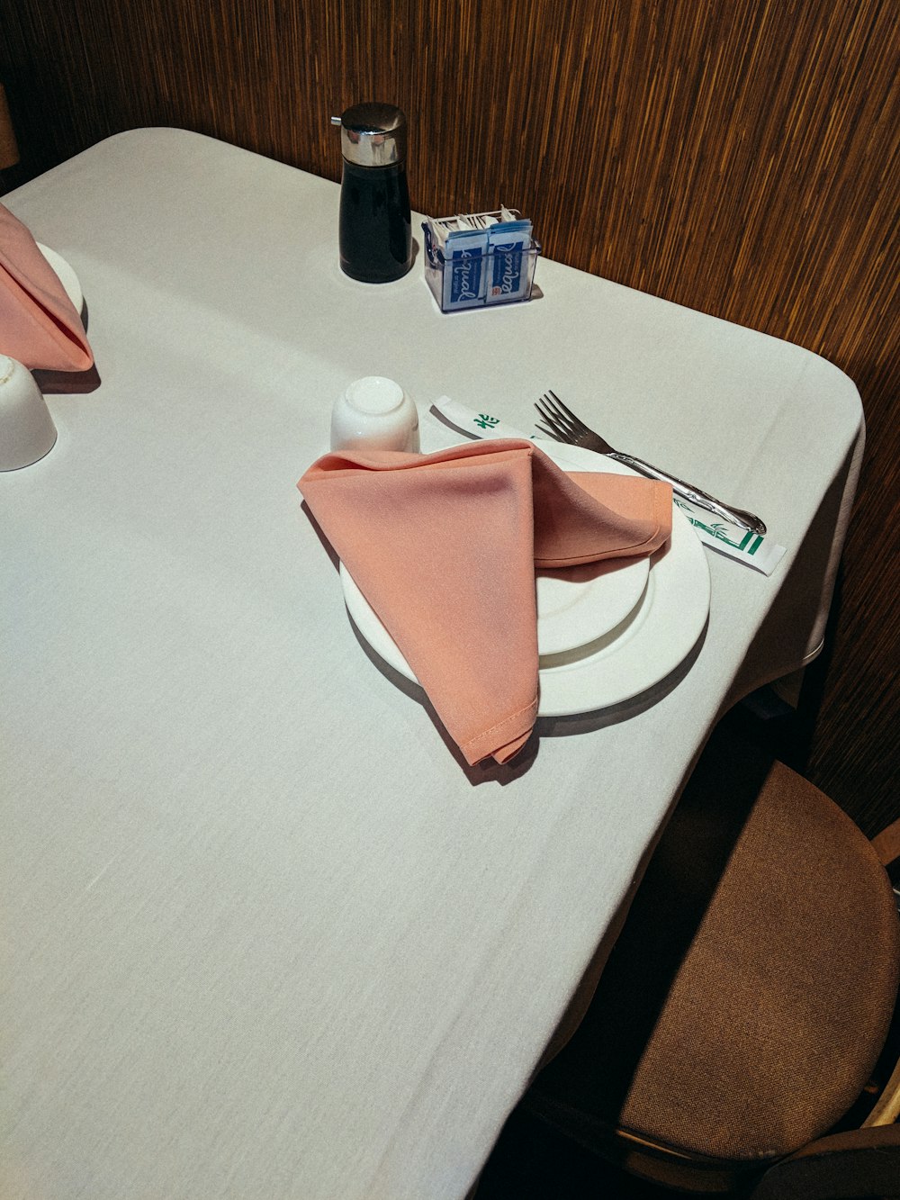 orange table napkin on plate