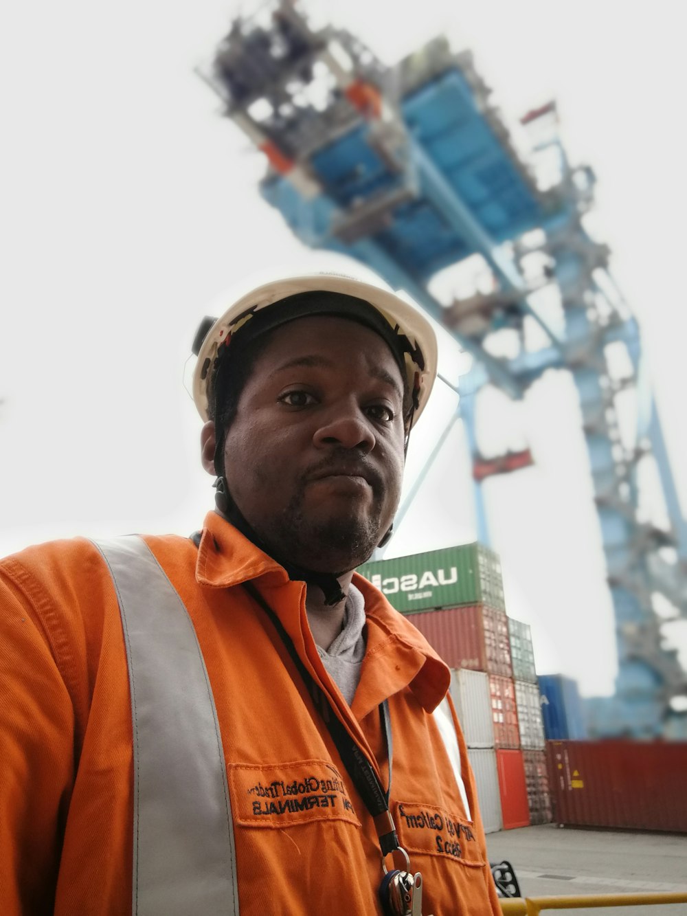 selective focus photography of man wearing hard hat and collared top