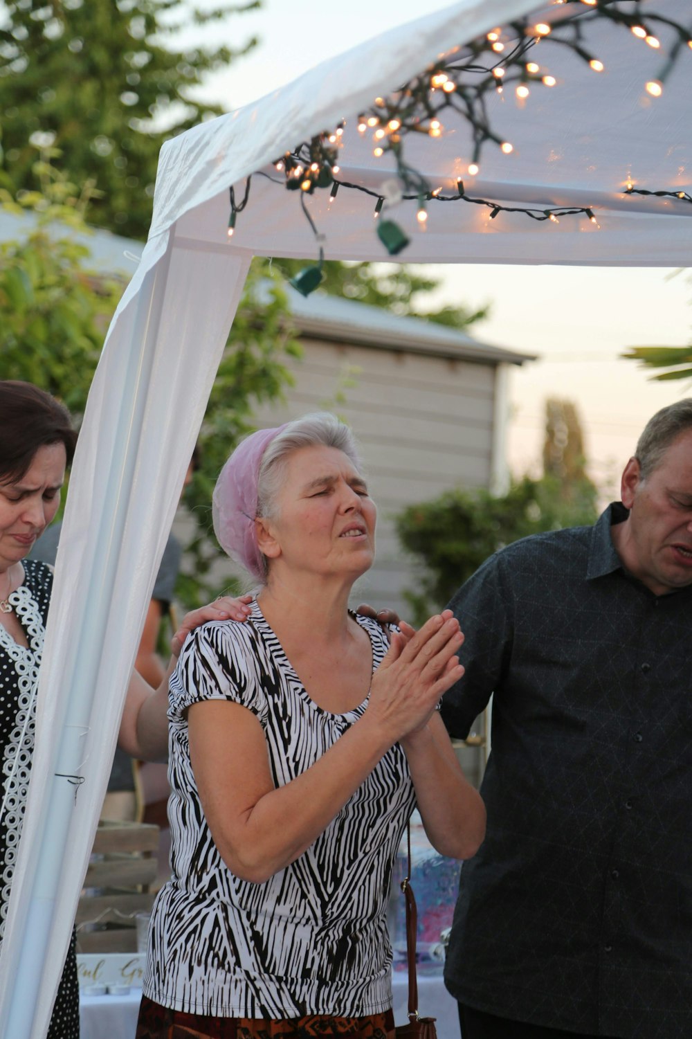 man and woman doing pray