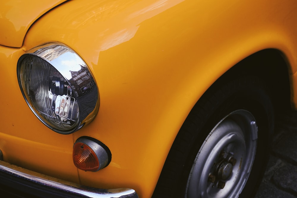 closeup photo of yellow car