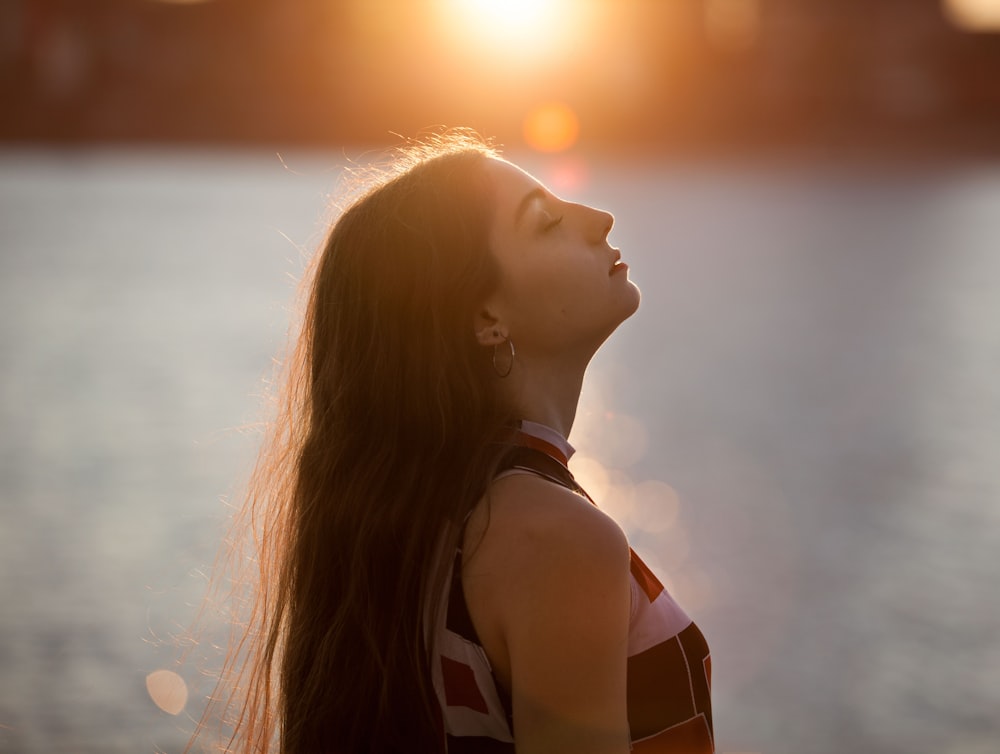 woman standing closing her eyes