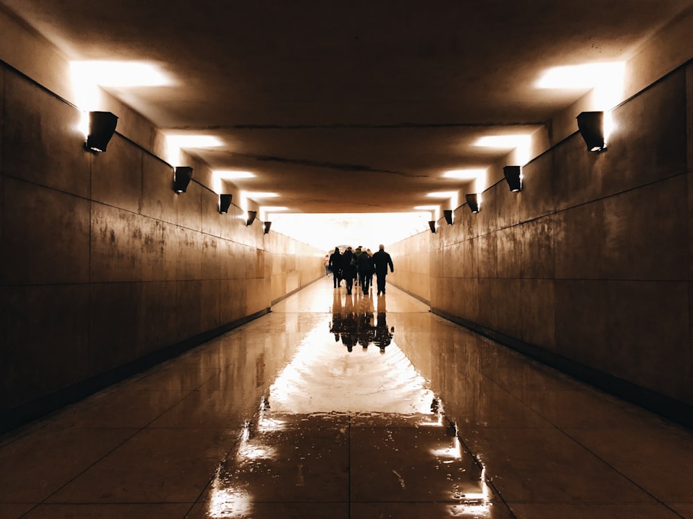 group of people walking on corridor