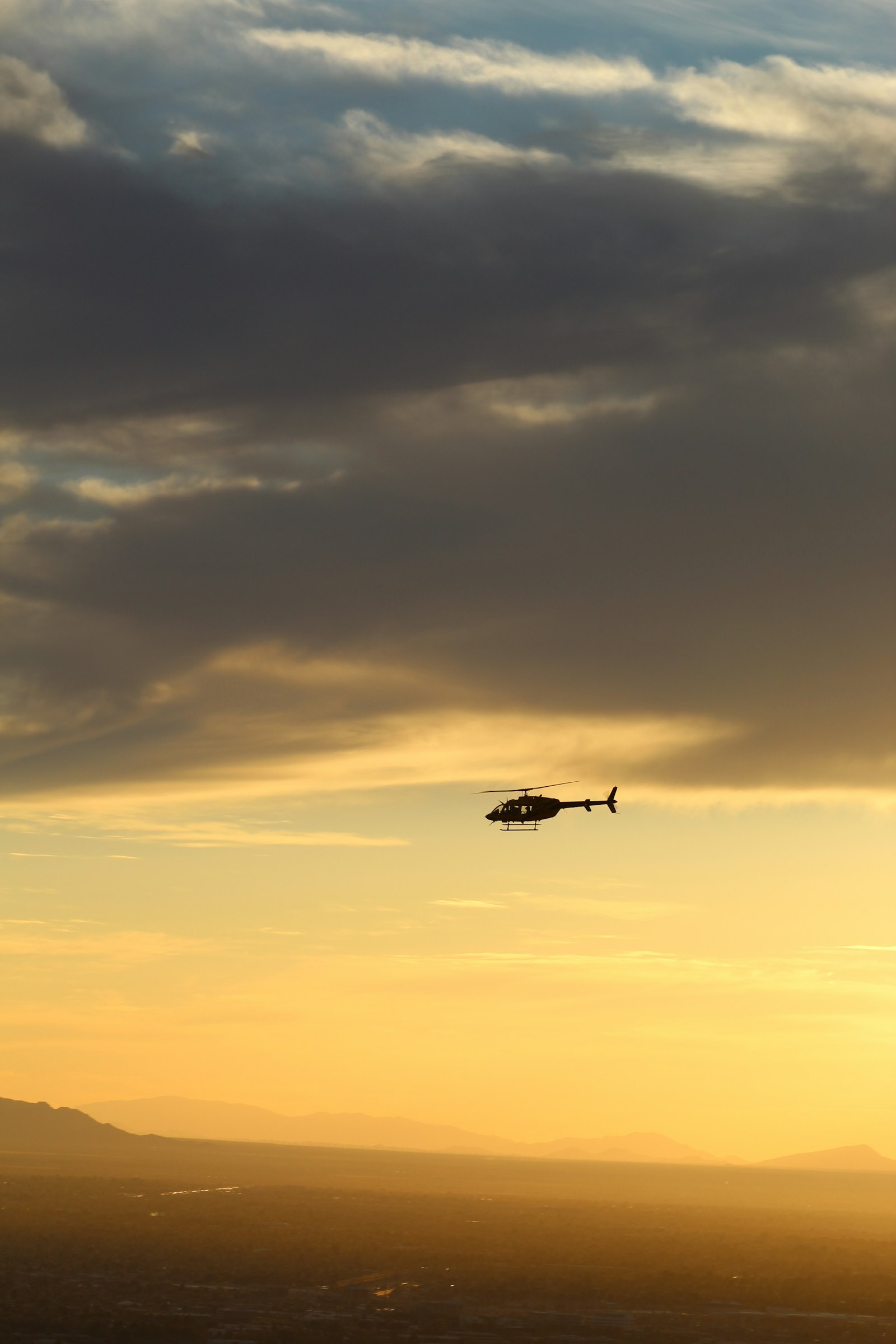 Canon EOS 1300D (EOS Rebel T6 / EOS Kiss X80) + Canon EF 75-300mm f/4-5.6 sample photo. Black helicopter on air photography