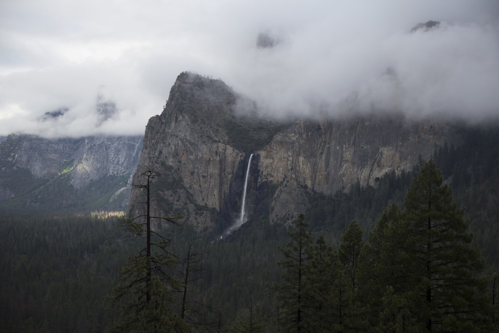 photo of brown mountains under cloudy sky during daytime