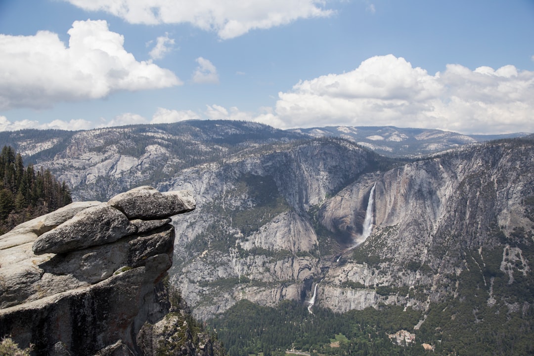 cliff overlooking mountain range