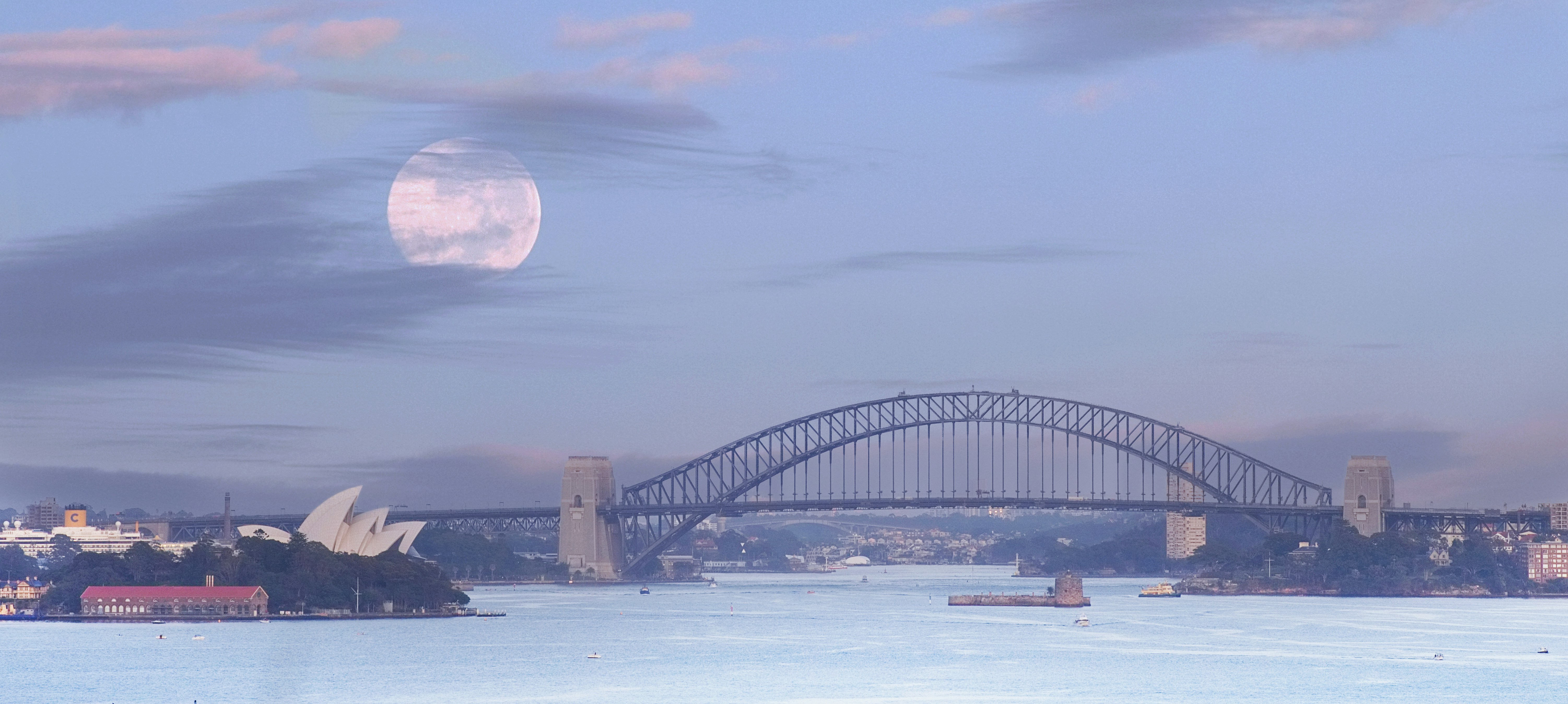 There’s only a few times each year that the full moon sets behind the Sydney Harbour Bridge in this composition, and I’d planned this shot weeks in advance. This was taken after dawn on a cold Saturday morning in between the clouds. In person the full moon is a grand sight moving quickly through the sky towards the city. In this shot I’ve tried to evoke how I felt standing there watching it balanced between these two Sydney icons, which - open disclosure - required some adjustment to the moon size.