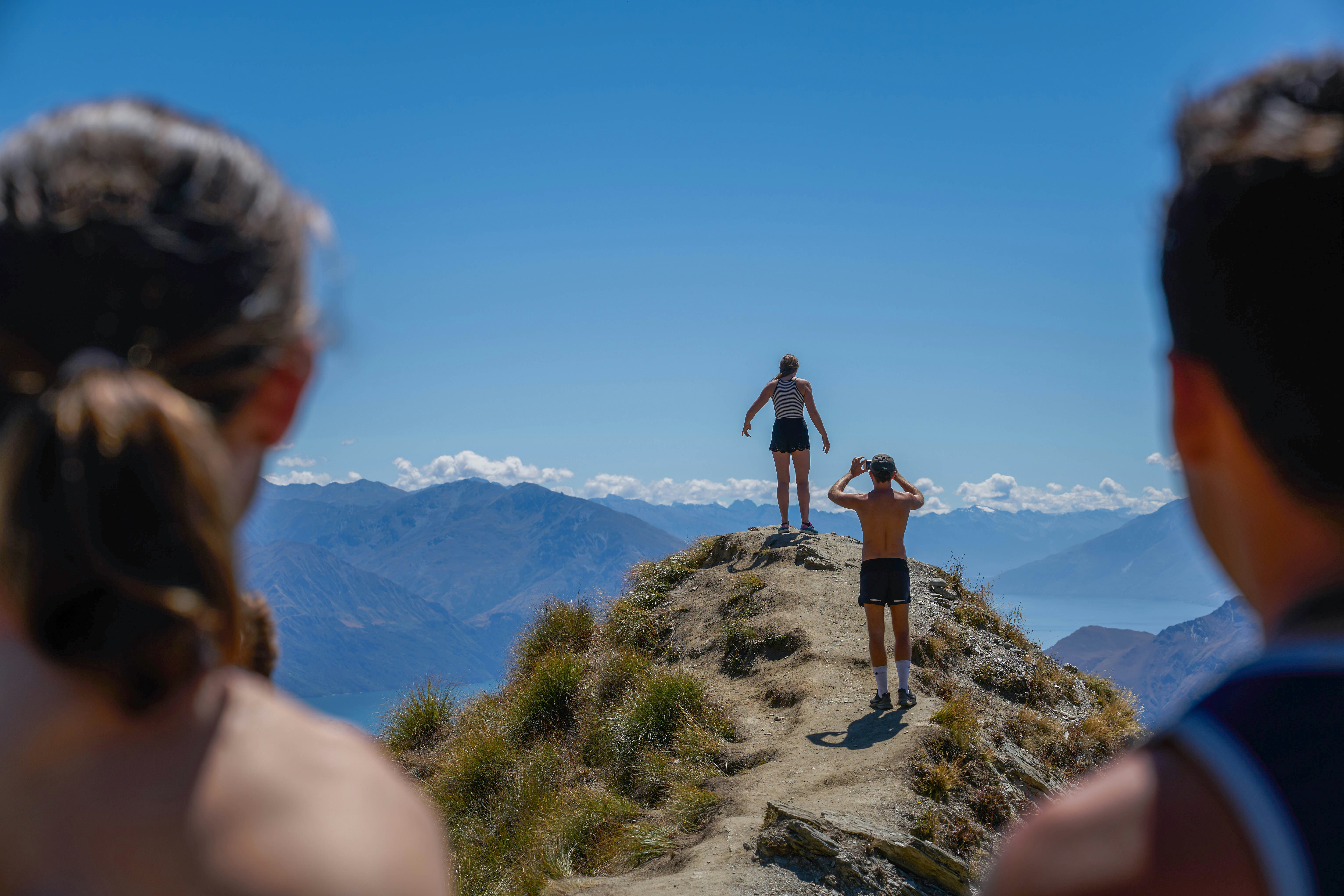 man and woman on top of the mountain