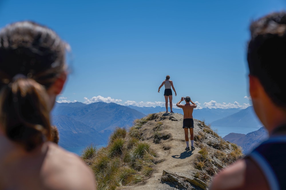 man and woman on top of the mountain