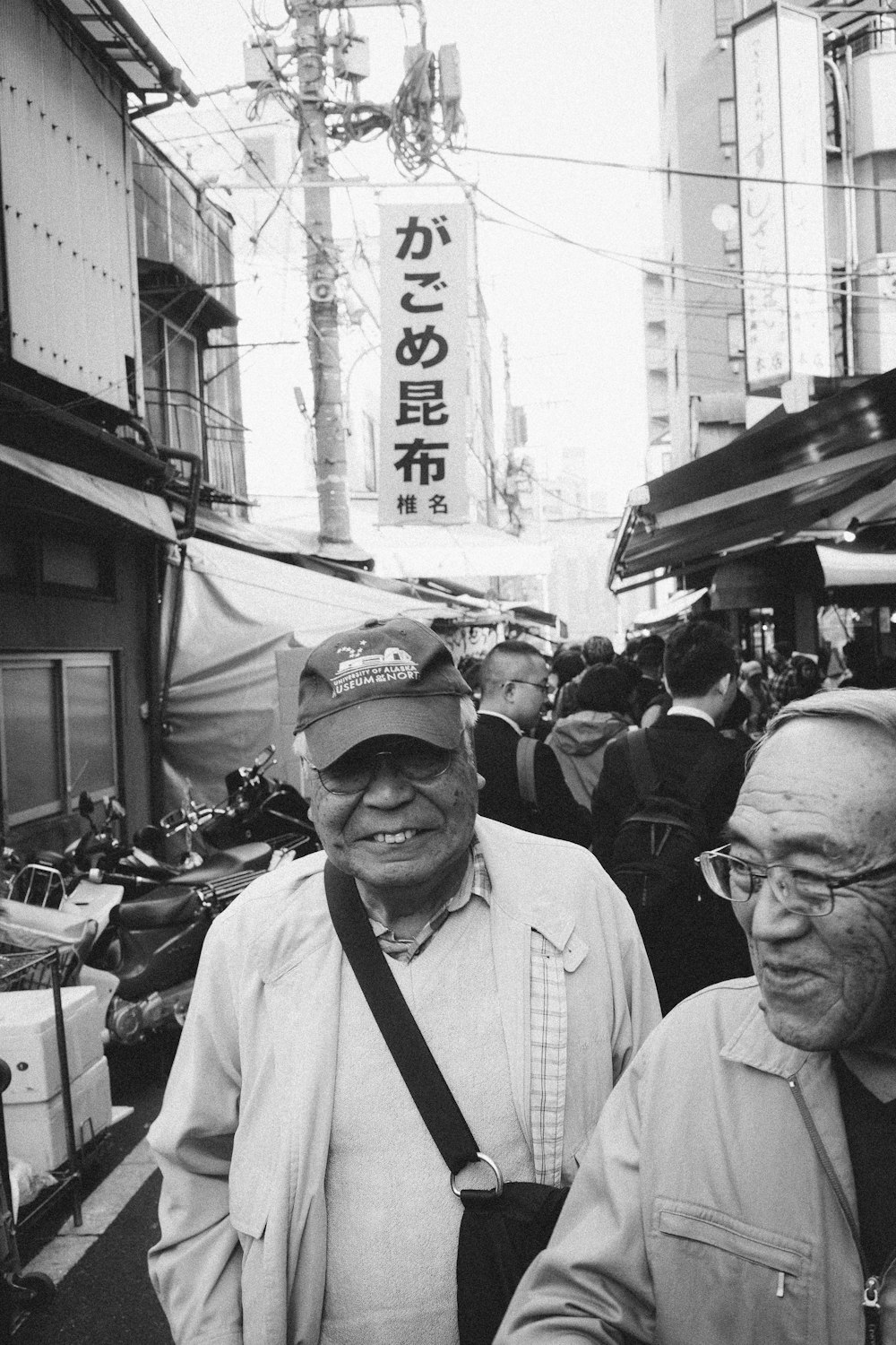 grayscale photography of man wearing cap