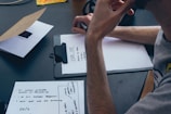 person leaning on table