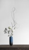 white flowers in blue vase