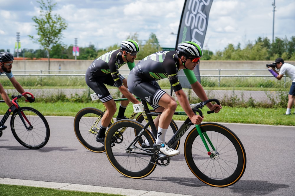 two man riding road bicycle