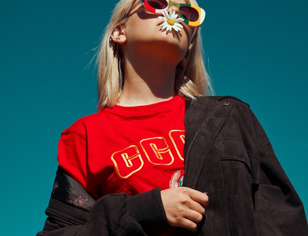 woman with sunglasses standing outdoor during daytime