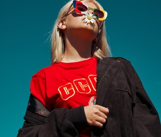 woman with sunglasses standing outdoor during daytime