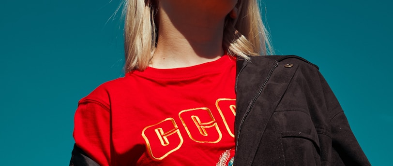 woman with sunglasses standing outdoor during daytime