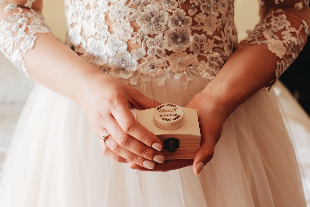 woman holding white box