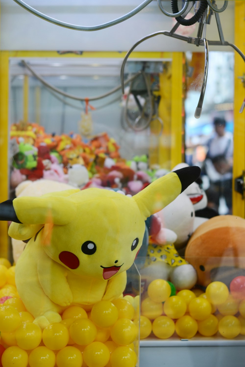 Pokemon Pikachu plush toy in claw machine