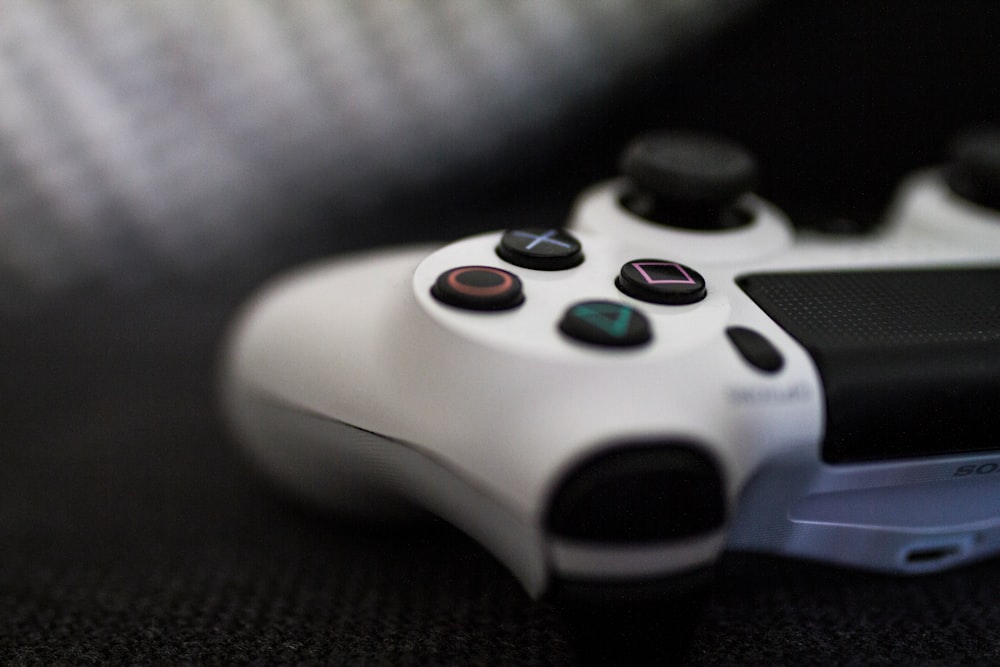closeup of white Sony PS4 controller