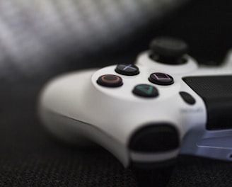 closeup of white Sony PS4 controller