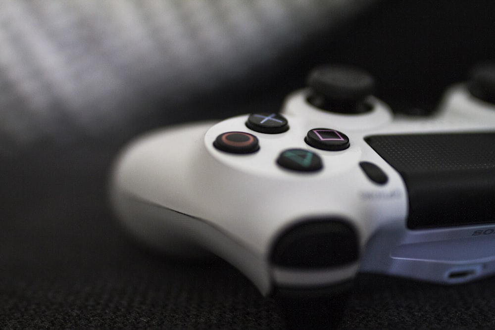 closeup of white Sony PS4 controller