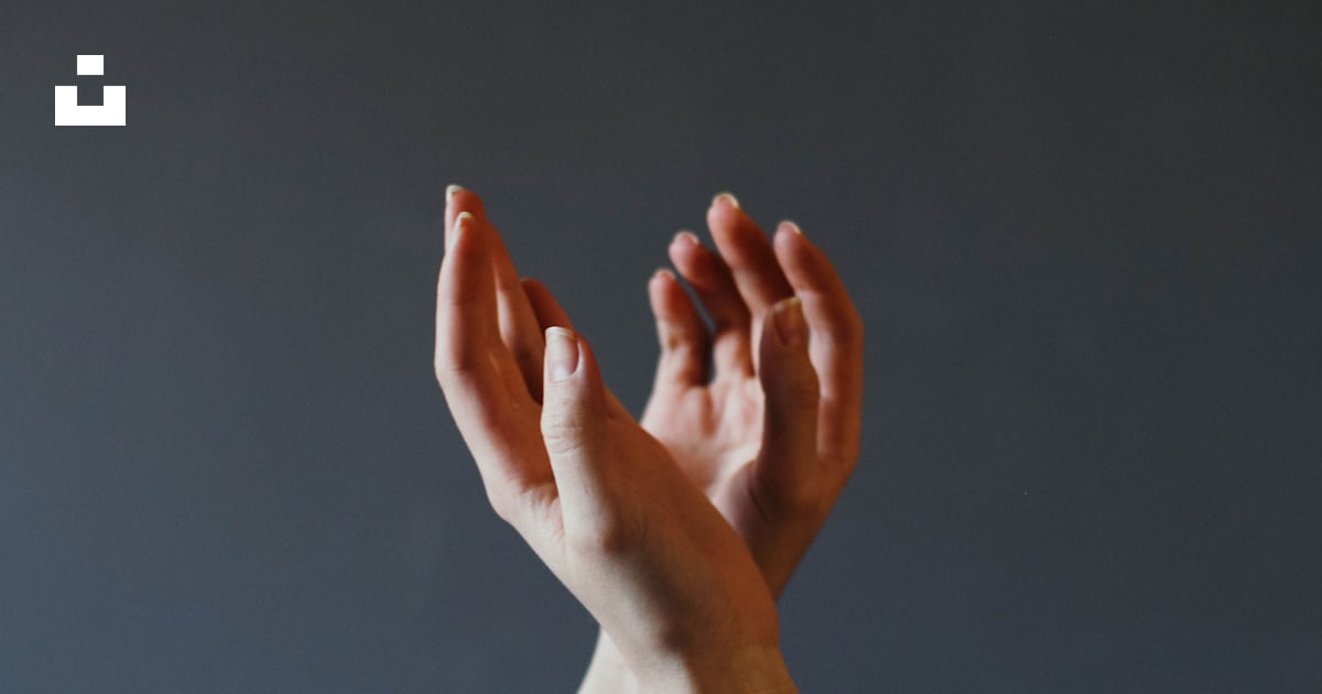 Left hand over right hand with gray background photo – Free Hands Image ...