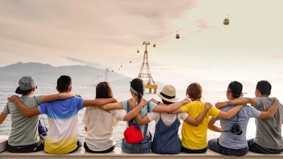 people holding shoulders sitting on wall friends zoom background