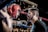 man in black talking to boxer inside ring