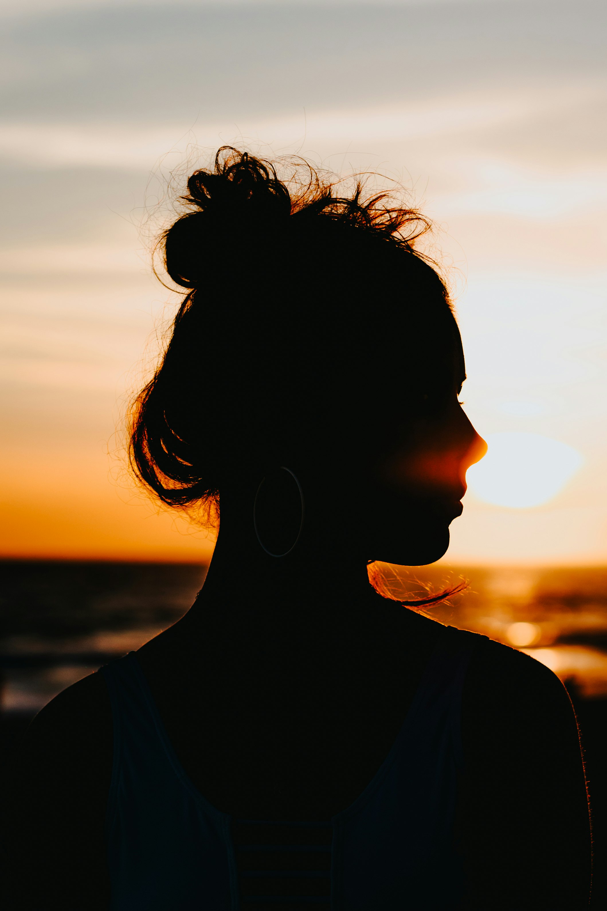 silhouette of woman looking sideways