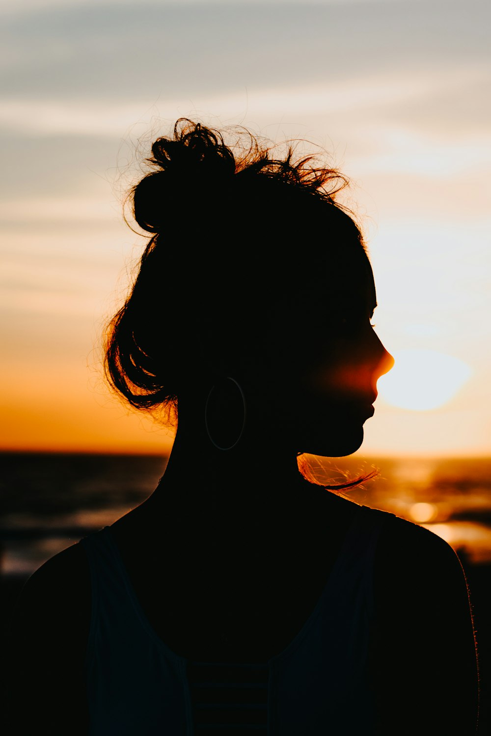 silhouette of woman looking sideways