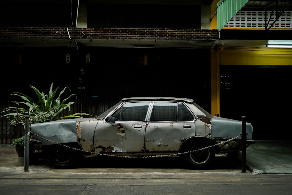 wrecked gray sedan