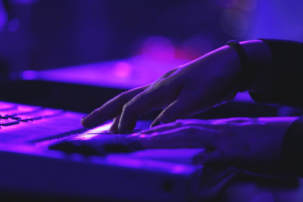 person's hand on laptop