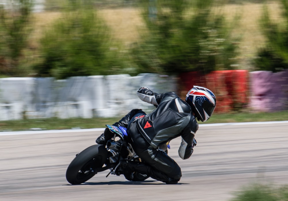 panning photography of rider riding bike during daytie