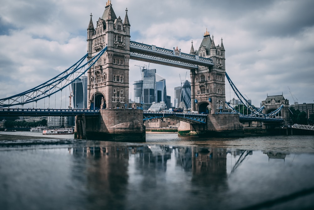 London Tower Bridge taken under white clouds during daytime