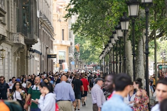 A bustling city street filled with diverse people and architecture.