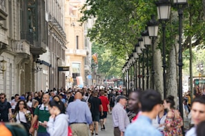 A bustling city street filled with diverse people and architecture.
