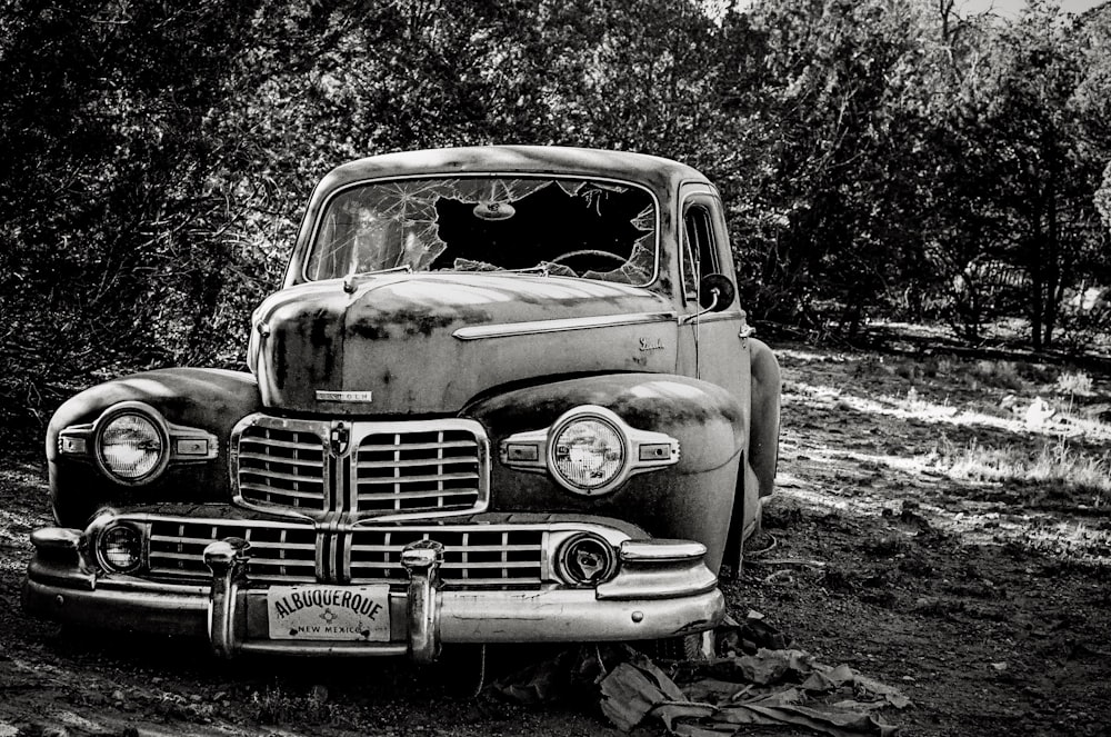 classic vehicle parked near trees