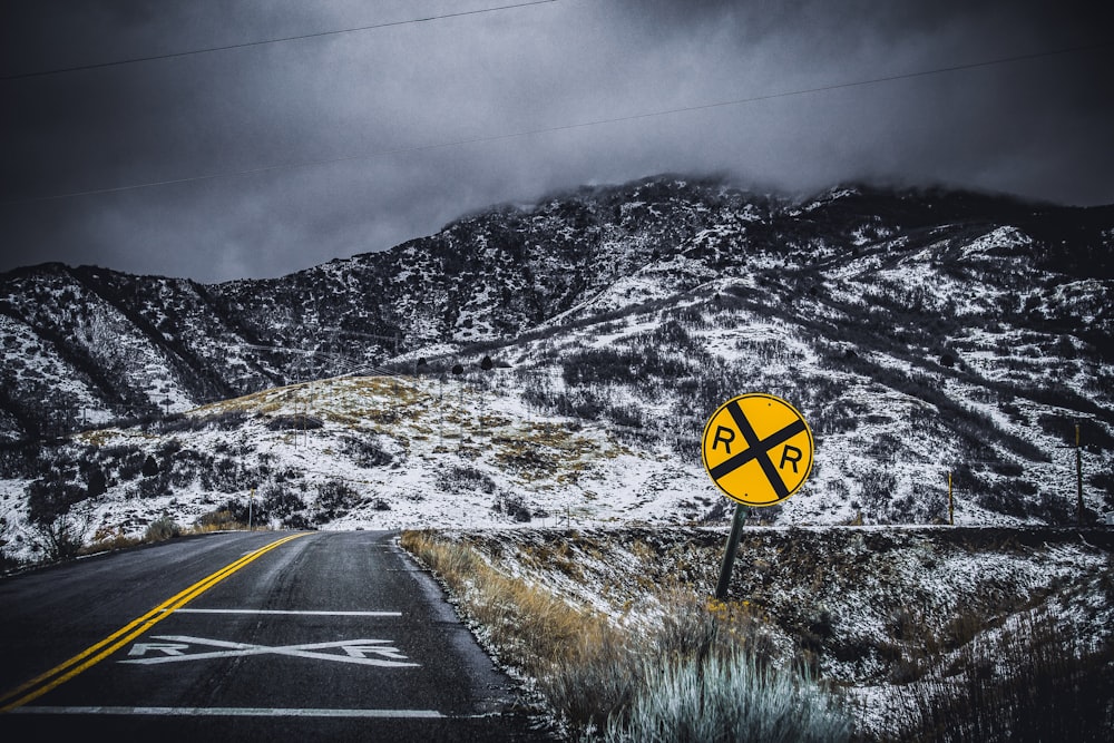 yellow and black road signage on roadside