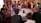 A group of friends discussing digital products in a cozy setting.