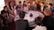 A group of diverse professionals discussing strategies around a conference table with digital devices.