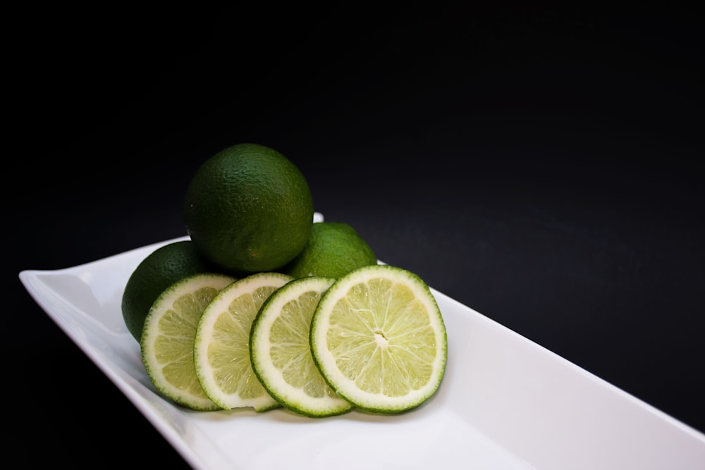 sliced lemons on white tray