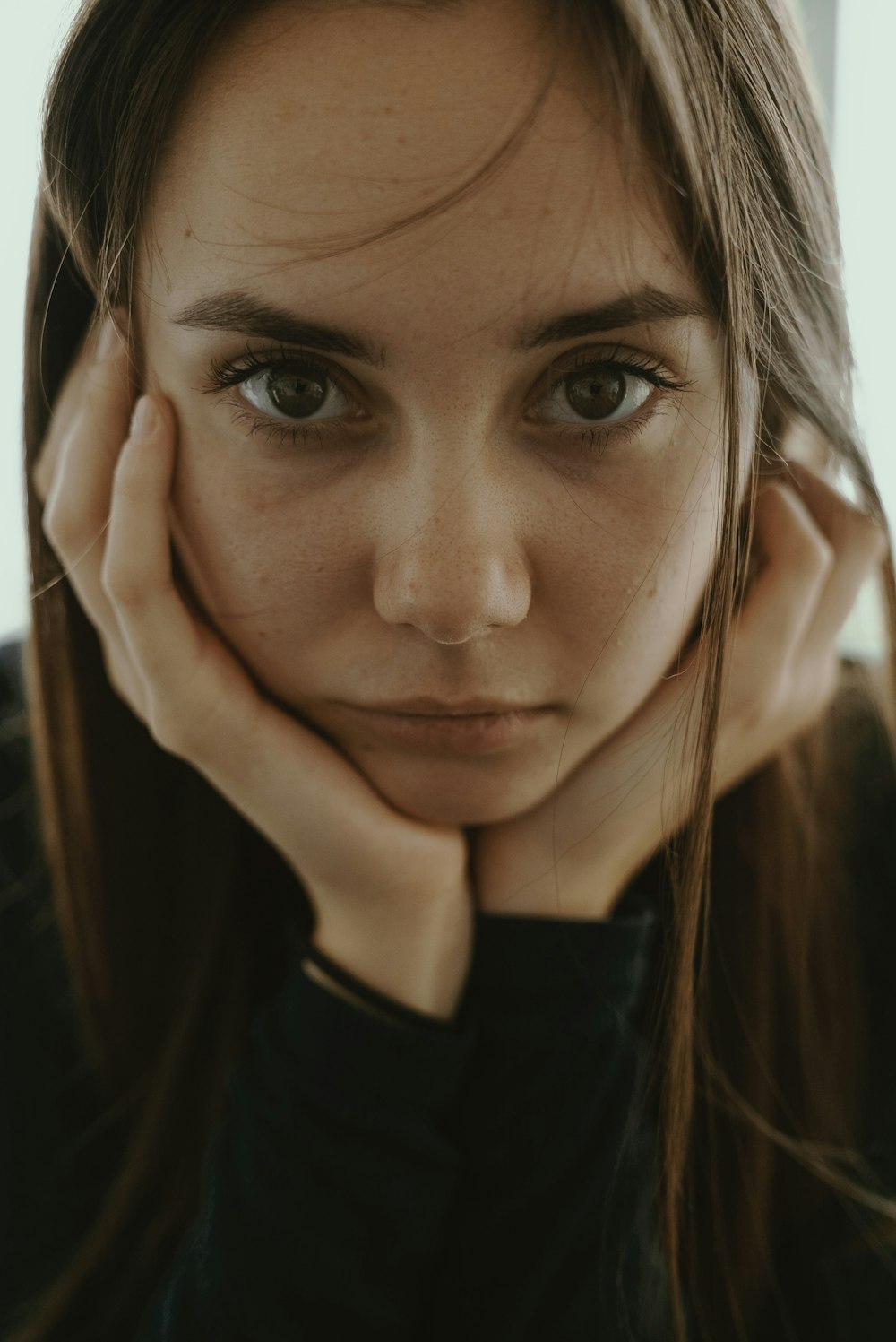 woman doing chin gesture while taking photo