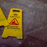 two Caution signages