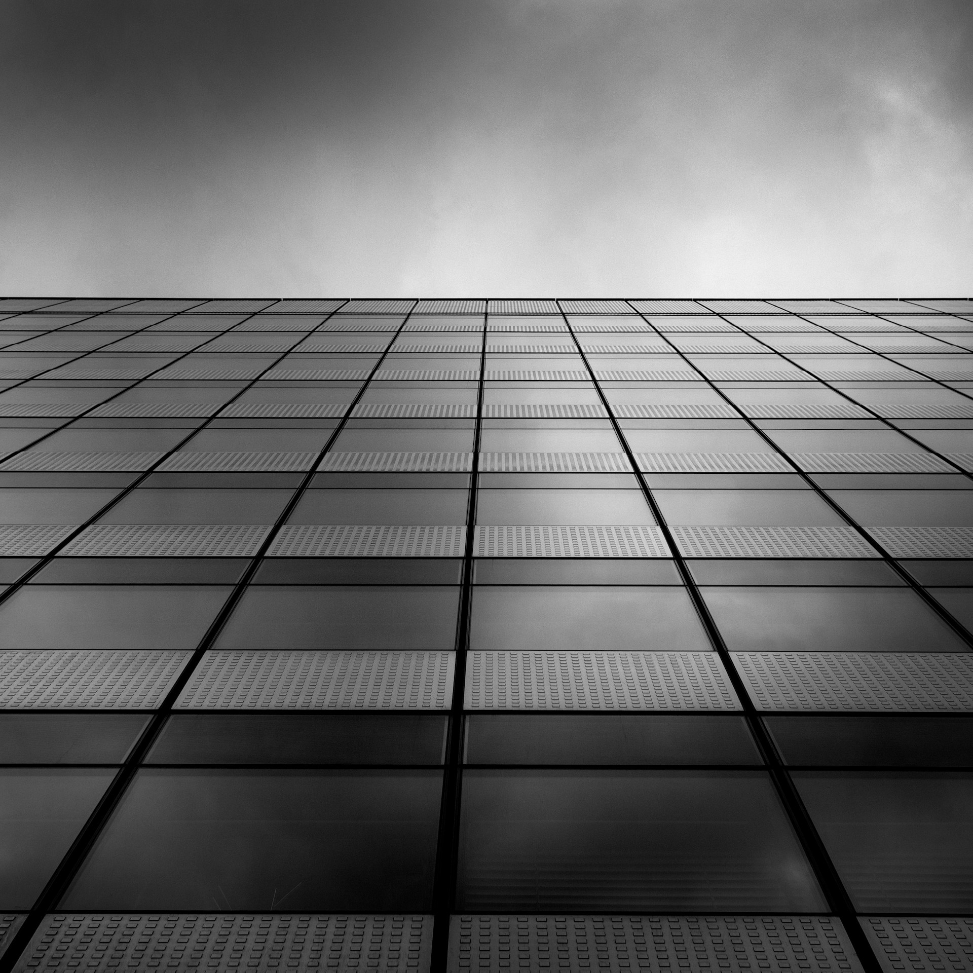 a black and white photo of a tall building