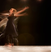 a couple of people that are dancing on a stage