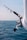 person holding black fishing rod