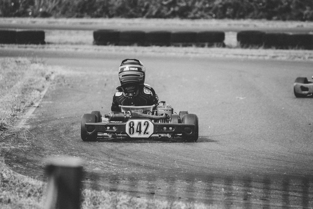 man riding go kart