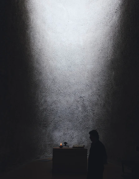 A serene altar inside the terreiro illuminated softly by candlelight.