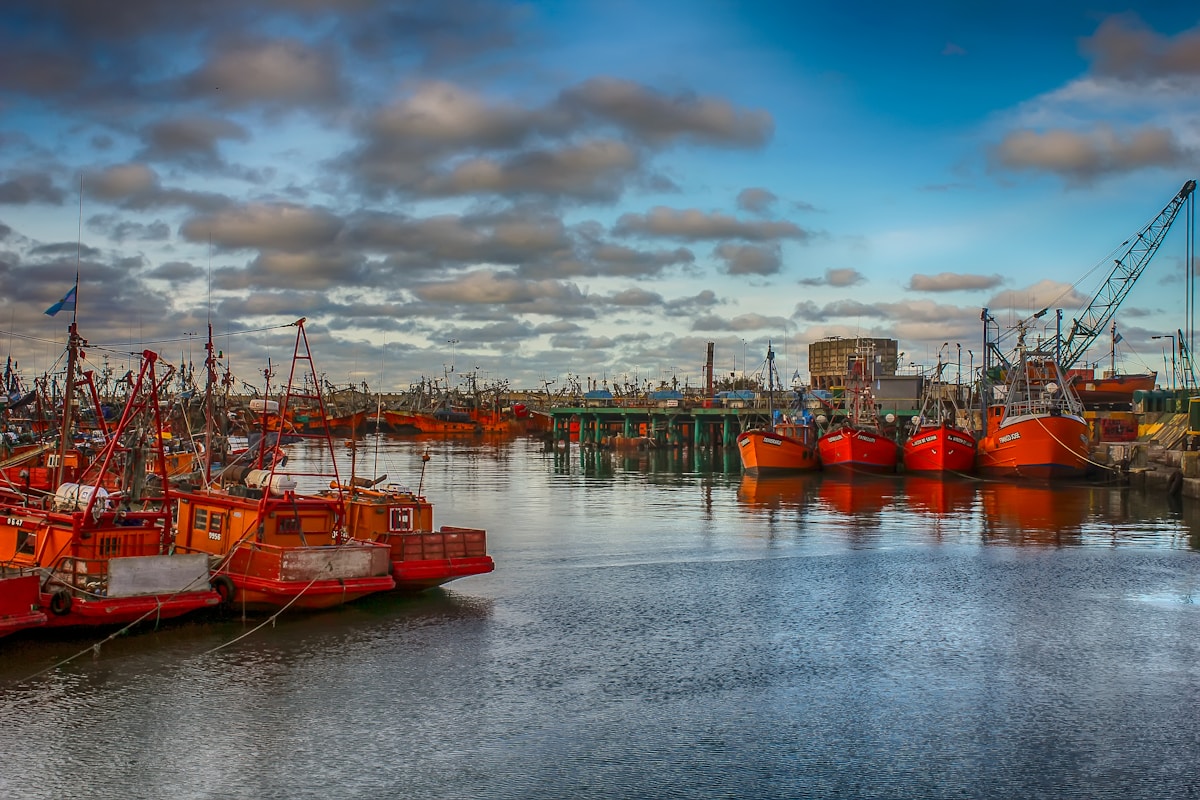 red boat on body of water