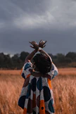 woman standing in the middle of wheat field